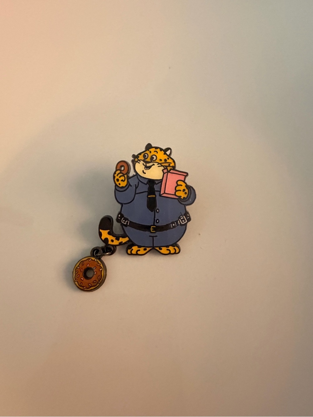 Disney Zootopia Charmed Blind Box enamel pin featuring Officer Clawhauser.